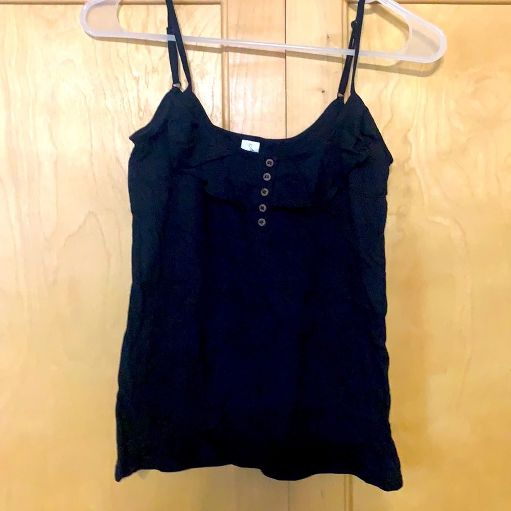 Black tank top with ruffle detail.